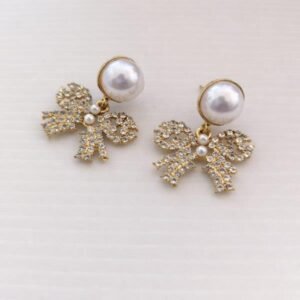 Cercei eleganți cu perlă și fundiță cu cristale 68D13C1426